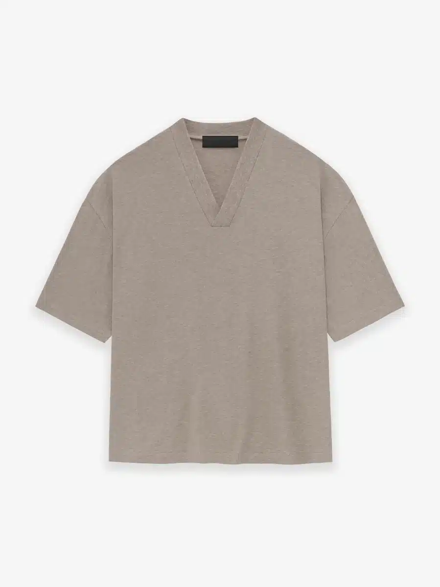 fp8qtypn0cojjguj6ggx_x600@2x.webp Fear of God Essentials V-Neck T-Shirt 'Core Heather' - Image 1