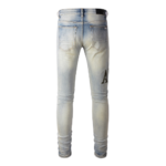 AMIRI Logo Distressed Skinny Jeans - Image 2