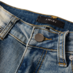 AMIRI Logo Distressed Skinny Jeans - Image 8