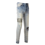 AMIRI Logo Distressed Skinny Jeans - Image 5