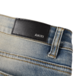 AMIRI Logo Distressed Skinny Jeans - Image 11